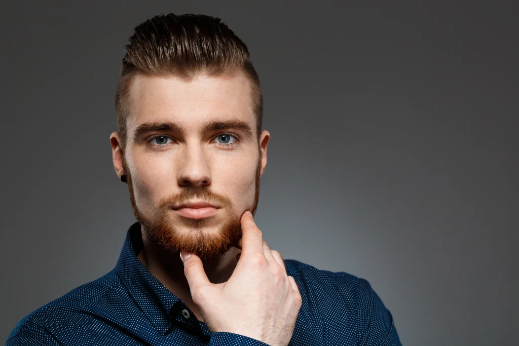 young-successful-businessman-posing-dark-wall